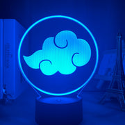 lampe 3D au motif du logo de ce groupement criminel. Cette fabuleuse lampe LED offre un incroyable effet 3D au motif du logo ; de quoi ravir les plus grands fans de l’Akatsuki et de l’anime en général | Boutique Mana-Zone.fr